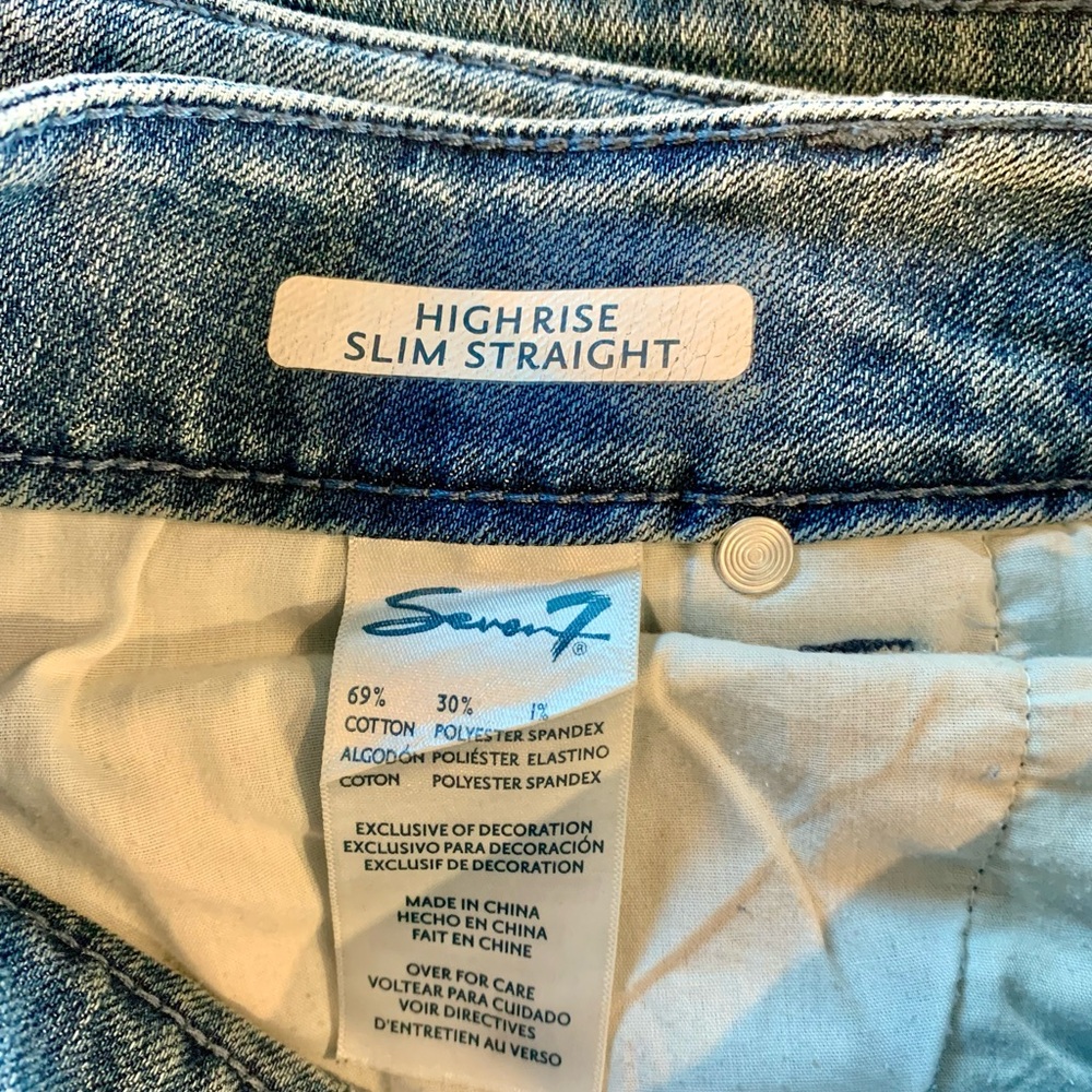 Fashionably distressed, stretch denim jeans.